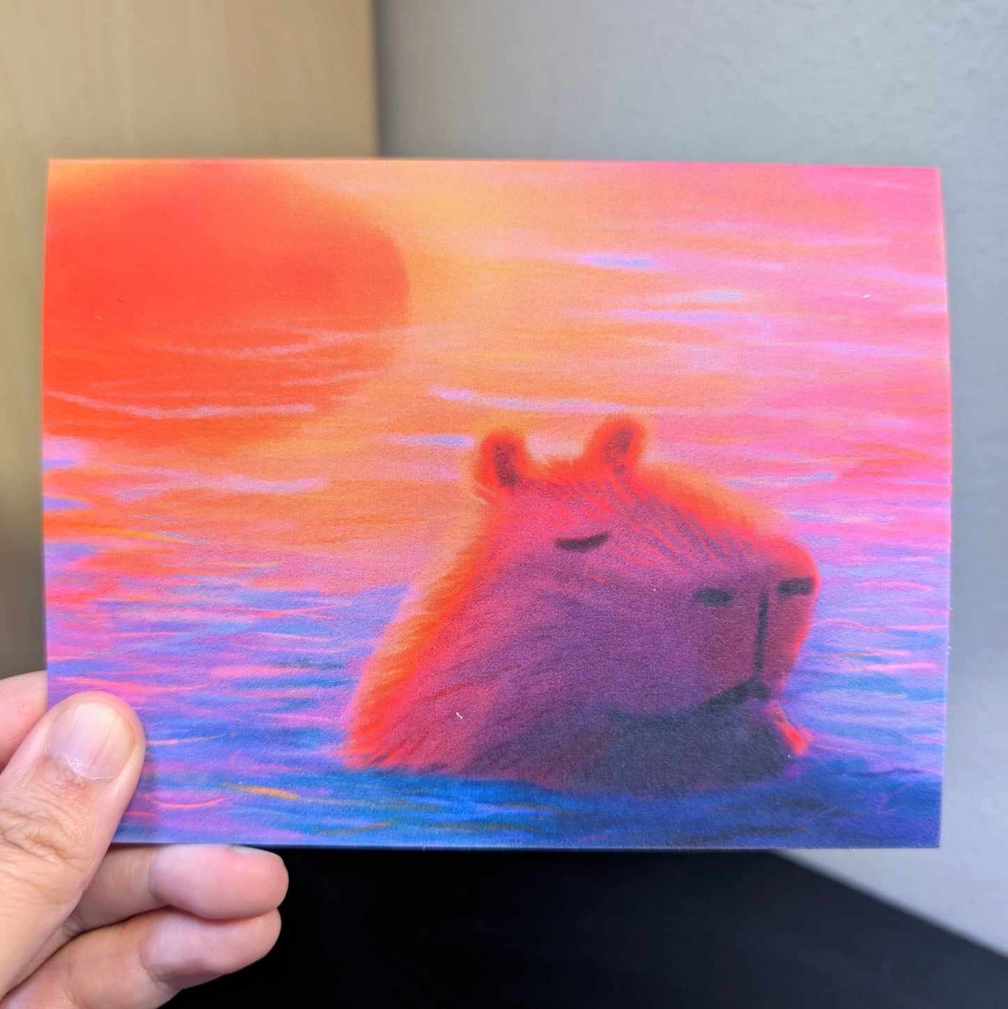 Capybara at Sunset Greeting Card - Blank Card with a Capybara Sleeping in Sunset-Colored Waters (Limited Quantities) Greeting Card JoyousJoyfulJoyness