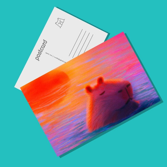Capybara at Sunset Postcard - Postcard with a Capybara Sleeping in Sunset-Colored Waters (Limited Quantities) Postcards JoyousJoyfulJoyness 