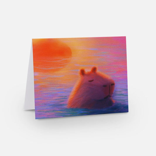 Capybara at Sunset Greeting Card - Blank Card with a Capybara Sleeping in Sunset-Colored Waters (Limited Quantities) Greeting Card JoyousJoyfulJoyness 